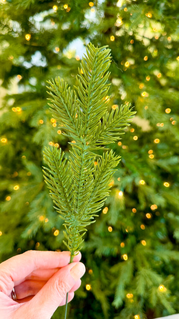 A single artificial pine branch.
